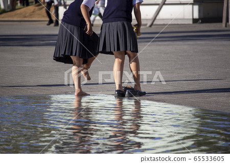School girls playing in the water 65533605