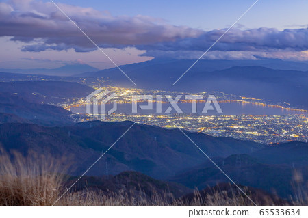 Mt. Fuji and Lake Suwa at dusk seen from Takabocchi Plateau in Okaya City, Nagano Prefecture Mt. Fuji and Lake Suwa at dusk seen from Takabocchi Plateau in Okaya City, Nagano Prefecture 65533634