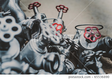 Industrial valves with red wheels. close-up  65536890