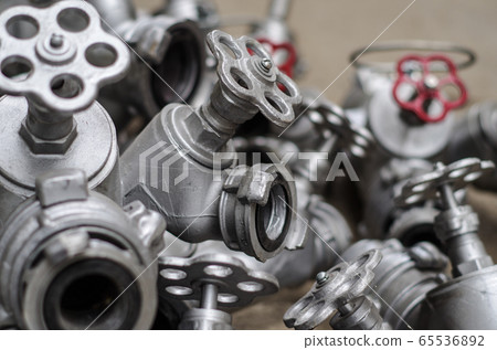 Industrial valves with red wheels. close-up  65536892
