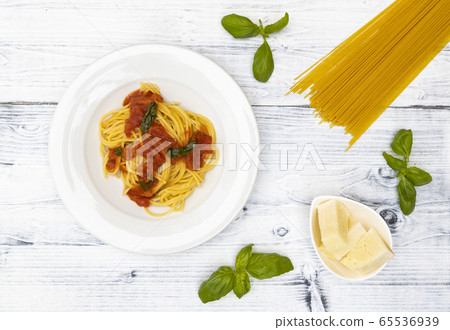 still life with spaghetti with tomato sauce and 65536939