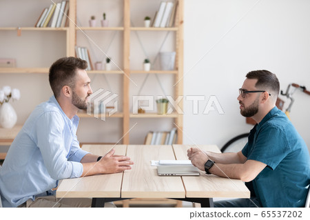 Side view young man applicant introduction himself to hr manager., 65537202