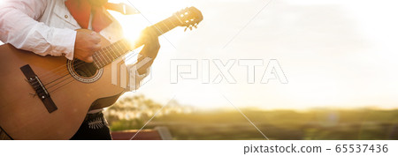 Mexican musician play in the city. City street in the summer. Mexican musician play in the city. City street in the summer. 65537436