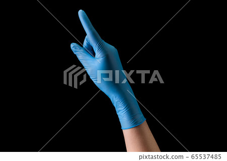 Doctor's hand in medical gloves touching screen by Doctor's hand in medical gloves touching screen by 65537485