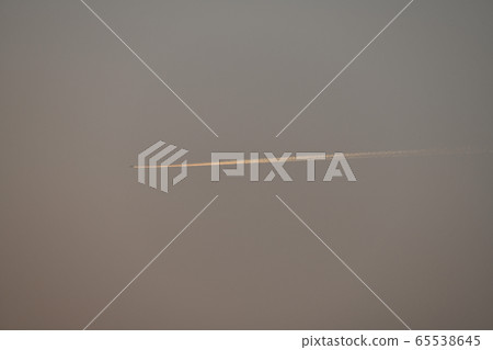 Mitigating air pollution in Corona, Tokyo cityscape in Japan?・Good visibility ・A line of light ・A contrail far beyond the evening sky 65538645