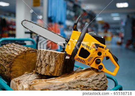 Chainsaw in power tool store closeup, nobody 65538718