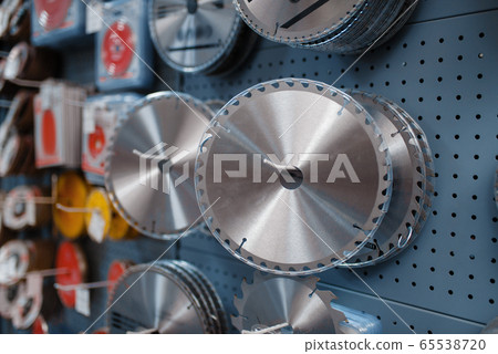 Edged discs for saws in tool store closeup, nobody 65538720