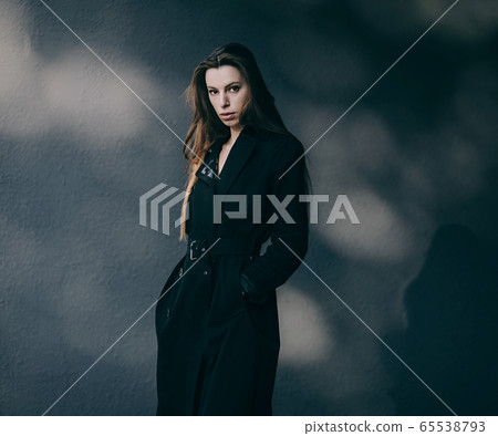 Fashionable woman in coat Fashionable woman in coat 65538793
