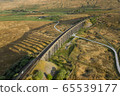 A drone shot of The Ribblehead Viaduct a Grade II listed structure, the Viaduct runs the Settle to Carlisle railway route in North Yorkshire, England. 65539177