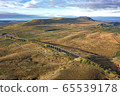 A drone shot of The Ribblehead Viaduct a Grade II listed structure, the Viaduct runs the Settle to Carlisle railway route in North Yorkshire, England. 65539178