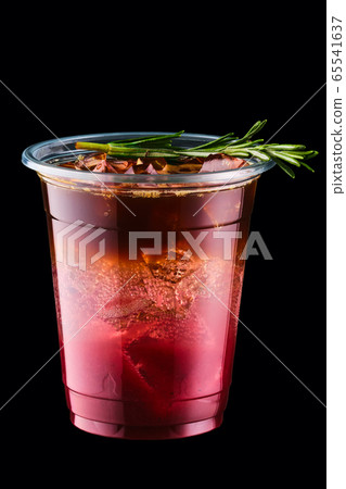 Espresso tonic with cherry juice in take away cup 65541637