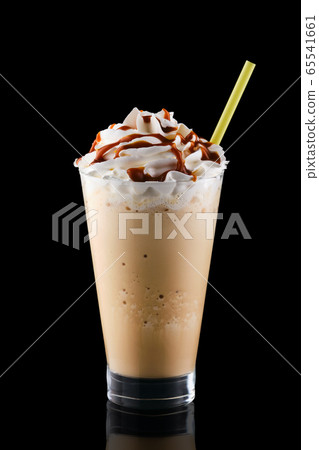 Caramel milkshake isolated on black background Caramel milkshake isolated on black background 65541661