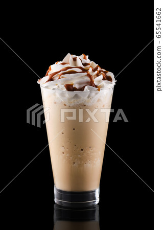 Caramel milkshake isolated on black background 65541662