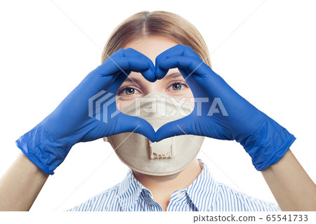 Happy doctor woman in protective mask making heart 65541733