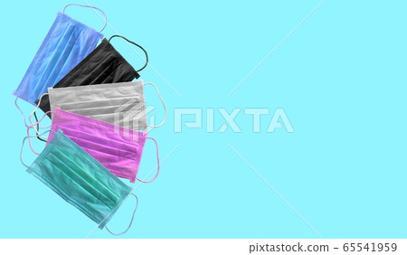 Medical mask for corona or covid-19 virus with colorful ,safety breathing masks for virus inflection,isolated on blue background, health protection concept,cover mouth and nose to prevent virus Medical mask for corona or covid-19 virus with colorful ,safety breathing masks for virus inflection,isolated on blue background, health protection concept,cover mouth and nose to prevent virus 65541959
