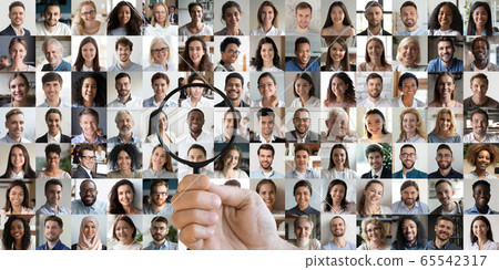 Hr holding magnifying glass choosing african candidate among people faces 65542317