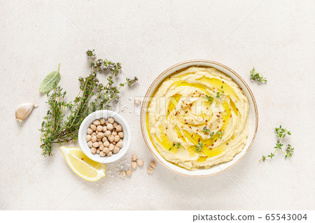 Hummus, mashed chickpeas with lemon, spices and Hummus, mashed chickpeas with lemon, spices and 65543004