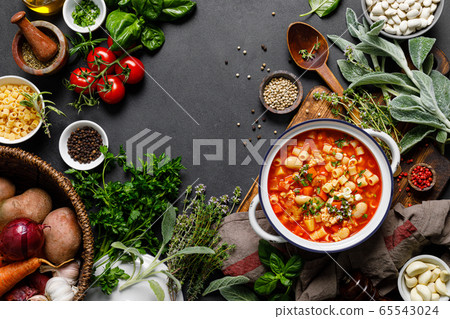 Cooking pasta e fagioli soup with chicken meat and 65543024