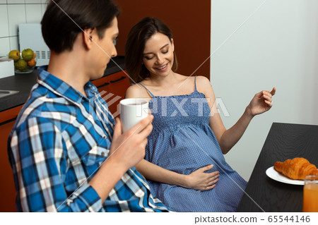Joyful young couple is waiting for child Joyful young couple is waiting for child 65544146