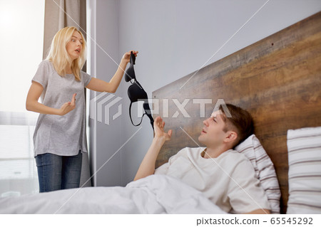 the woman found some bra near the bed the woman found some bra near the bed 65545292