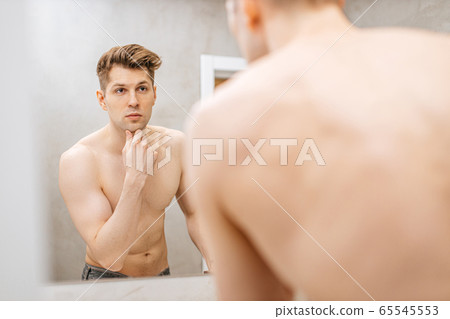 good-looking guy in bathroom at morning 65545553