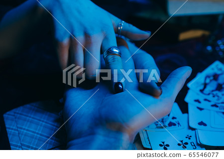 reading the lines hand in a man's hands 65546077