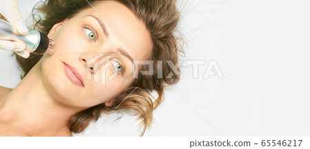 Dermatology skin care facial therapy. Medical spa anto wrinkles procedure. Woman 65546217
