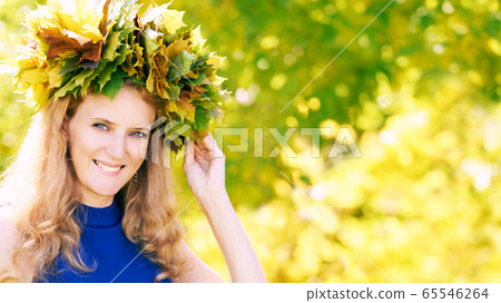 Autumn girl portrait. Beauty female fall lifestyle. Leaves 65546264