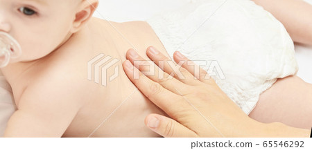 Newborn boy, mother hand. Infant mom massage. 65546292