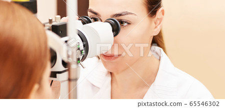 ophthalmologist doctor in exam optician laboratory with female patient. Eye ophthalmologist doctor in exam optician laboratory with female patient. Eye 65546302