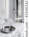 White bedroom interior with a wine glass on a tray on the bed 65546342