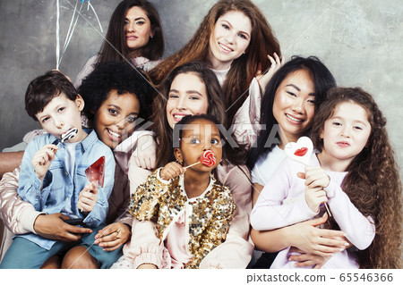 Lifestyle and people concept: young pretty diversity nations woman with different age children celebrating on birth day party together happy smiling, making selfie. African-american, asian and 65546366