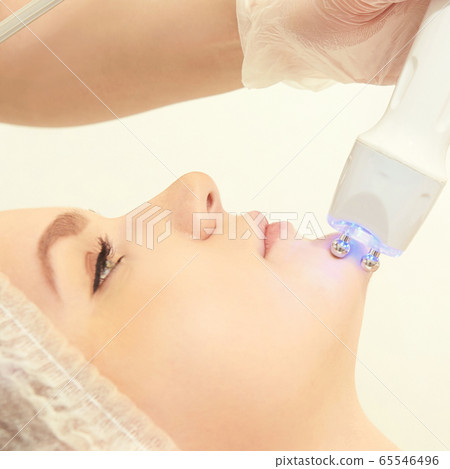 Dermatology skin care facial therapy. Medical spa anto wrinkles procedure. Woman face rejuvenation. Pretty girl. Rf cosmetician equipment 65546496