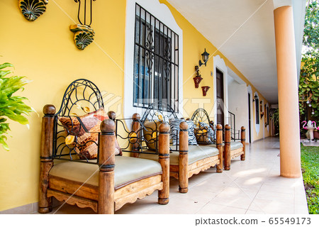 Sofa overlooking the hotel inner courtyard in Valladoli, Mexico 65549173