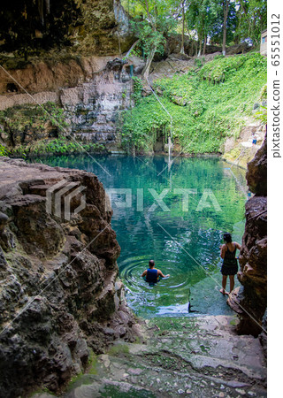 Mexican Valladolid person swimming in Cenote Sashi 65551012