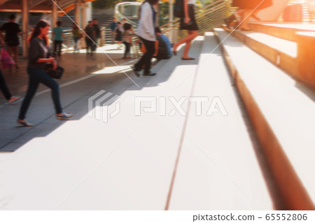 Stairs and people are walking. 65552806