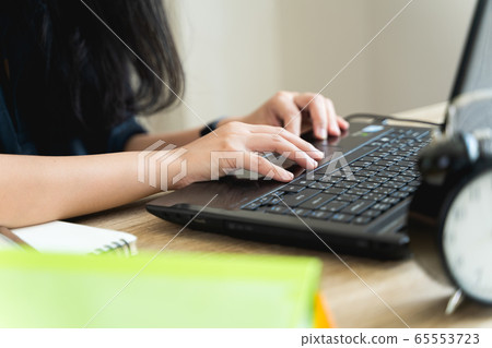 Close up hands of a woman typing the keyboard during work from home. Female programmers are programming, documenting, email, or chating in lifestyle and new normal concept with copy space Close up hands of a woman typing the keyboard during work from home. Female programmers are programming, documenting, email, or chating in lifestyle and new normal concept with copy space 65553723