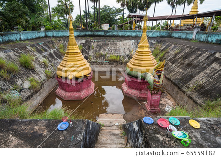 ShweguLay Pagoda in Bago the old capital cities of Myanmar. Bago is a town little visited by tourists located about 90 kilometers North East of Yangon. The town has a long and rich history. 65559182
