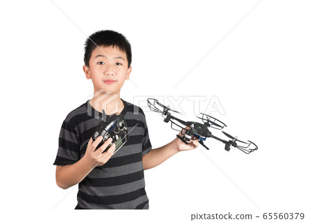 Asian boy holding drone and radio remote control 65560379