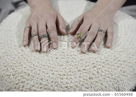 Female hands on the pillow Female hands on the pillow 65560498