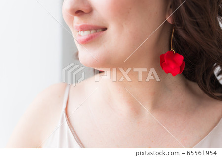 Elegant woman with earrings, close up portrait. Accessories, jewelry and bijouterie concept. Elegant woman with earrings, close up portrait. Accessories, jewelry and bijouterie concept. 65561954