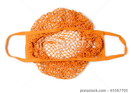 Empty reusable orange cotton shopping string bag 65567705