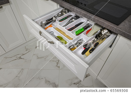 Kitchen drawer with content visible opened Kitchen drawer with content visible opened 65569308