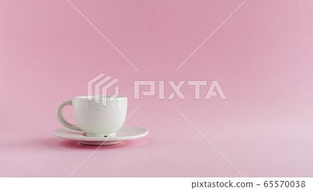 White coffee cup on pink background 65570038