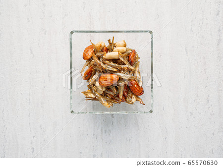 Fried anchovy with peanut and almond, one of the traditional Korean food 65570630