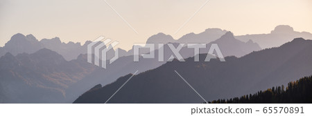 Evening Dolomite mountain tops silhouettes view 65570891
