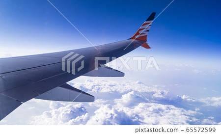View from airplane window to see sky on evening time. View from airplane window to see sky on evening time. 65572599