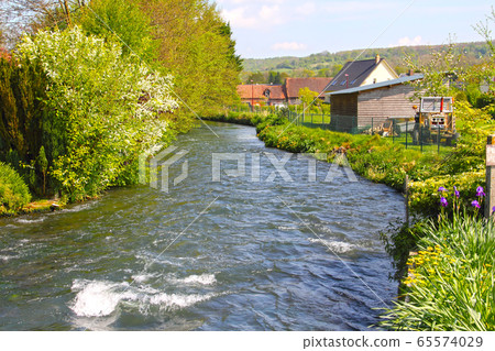 River in Normandy village 65574029