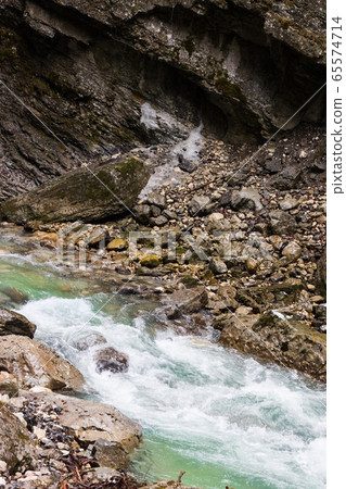 Snow-covered icicles at Partnachklamm, famous tourist destination. Partnachklamm 65574714
