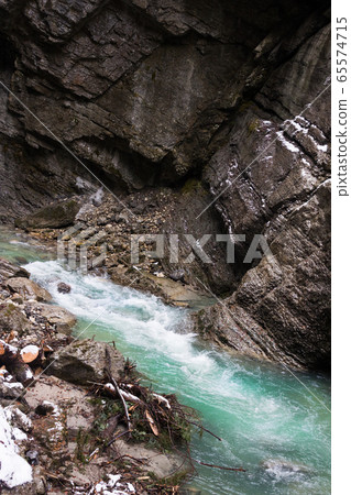 Snow-covered icicles at Partnachklamm, famous tourist destination. Partnachklamm Snow-covered icicles at Partnachklamm, famous tourist destination. Partnachklamm 65574715